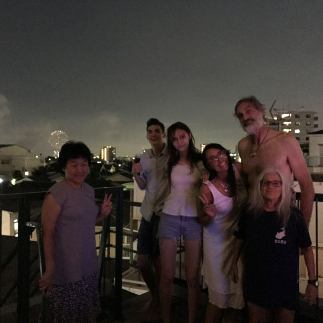 Enjoying fireworks on the rooftop.